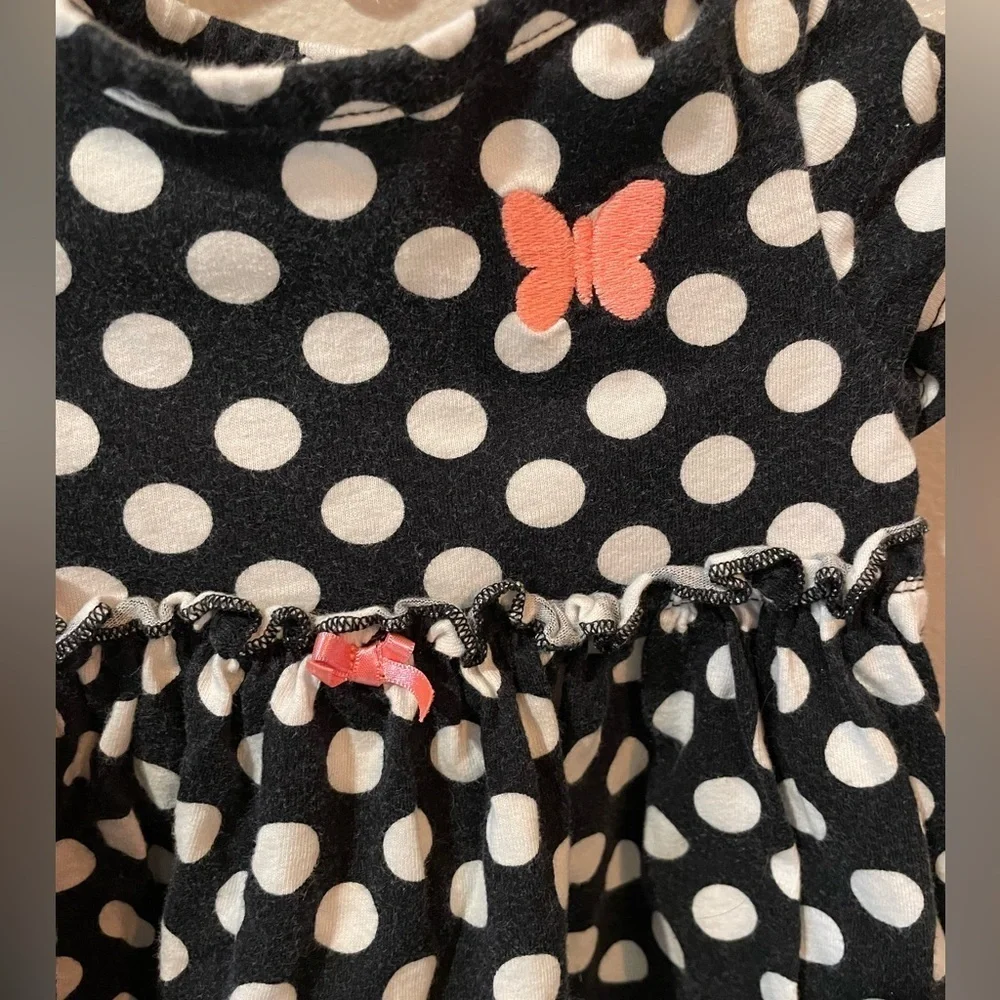 Carter’s Navy and white polka dot dress with pink butterfly and bow details.